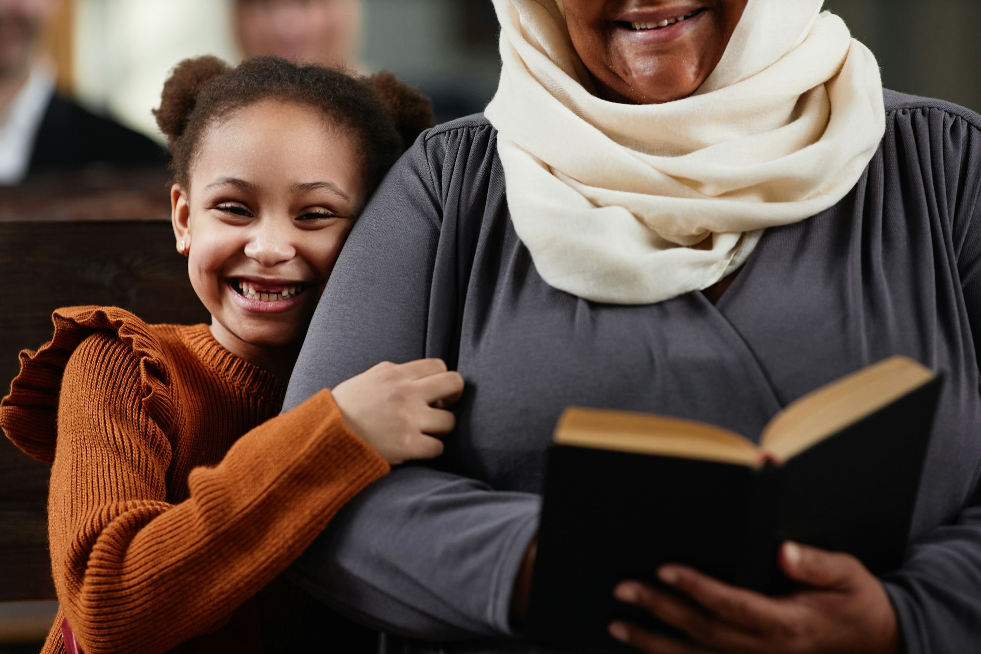 grandmother-with-granddaughter-visiting-to-church.jpg