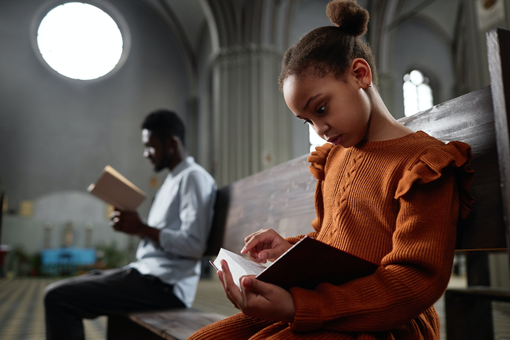 little-girl-reading-bible-in-church.jpg